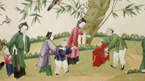 A close-up of Chinese wallpaper at Belton House, depicting bamboo, climbing plants and birds, with human figures in the foreground.